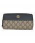 GUCCI（グッチ）の古着「ラウンドジップウォレット」｜ブラック×ベージュ