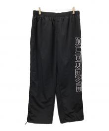 SUPREME（シュプリーム）の古着「ナイロンパンツ Spellout Embroidered Track Pant（スペルアウト エンブロイダリー トラック パンツ）」｜ブラック