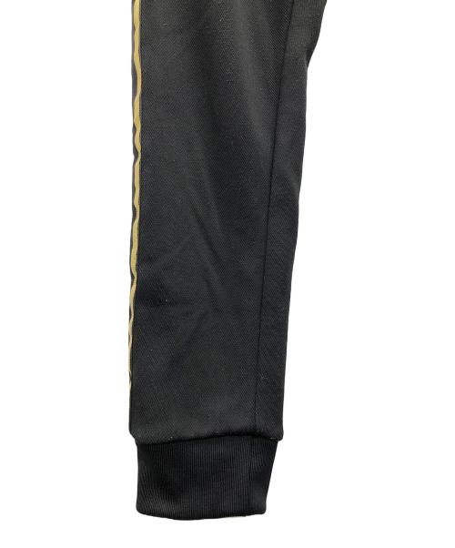 adidas（アディダス）adidas (アディダス) トラックパンツ　オリジナル スーパースター ブラック×ゴールド サイズ:XSの古着・服飾アイテム