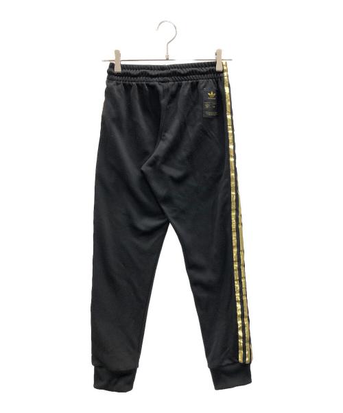 adidas（アディダス）adidas (アディダス) トラックパンツ　オリジナル スーパースター ブラック×ゴールド サイズ:XSの古着・服飾アイテム