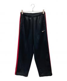 NIKE（ナイキ）の古着「トラックパンツ」｜ブラック×レッド