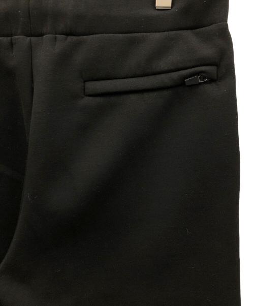 1minute 1second（ワンミニットワンセカンド）1minute 1second (ワンミニットワンセカンド) イージーパンツ cardboard knit pants with cursive print（カーボード ニット パンツ ウィズ カーシブ プリント） ブラック サイズ:Lの古着・服飾アイテム