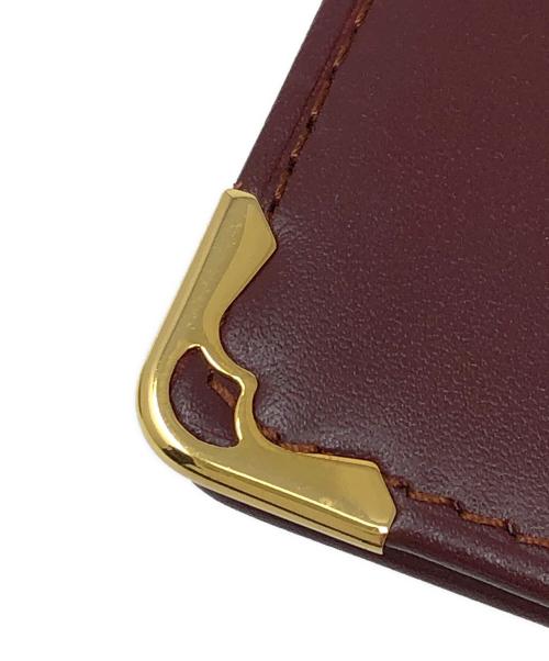 Cartier（カルティエ）Cartier (カルティエ) 長財布 二つ折り札入れ ワインレッド サイズ:実寸サイズにてご確認ください。の古着・服飾アイテム