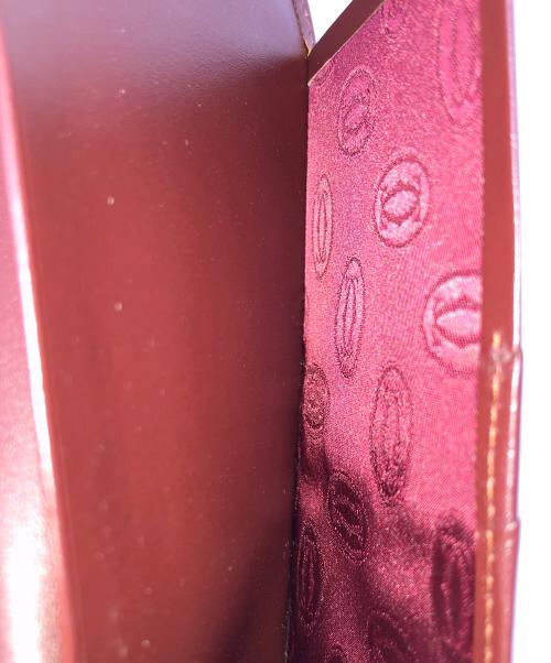 Cartier（カルティエ）Cartier (カルティエ) 長財布 二つ折り札入れ ワインレッド サイズ:実寸サイズにてご確認ください。の古着・服飾アイテム