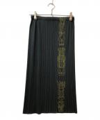 PLEATS PLEASEプリーツプリーズ）の古着「トーテムポール柄ロングプリーツスカート」｜グリーン