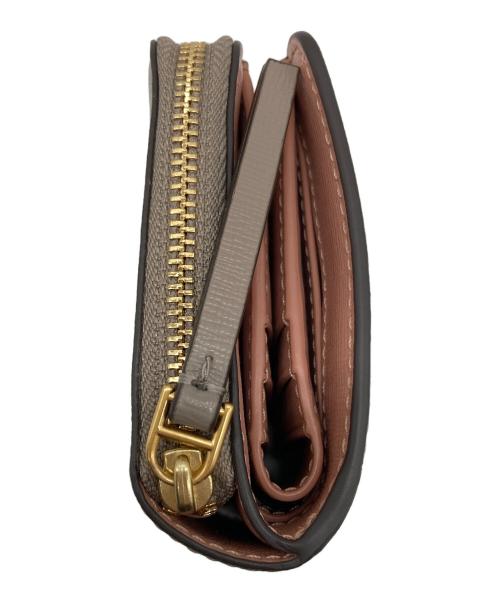 TORY BURCH（トリーバーチ）TORY BURCH (トリーバーチ) 2つ折り財布 グレーの古着・服飾アイテム