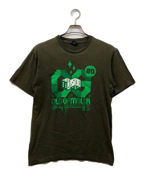 stussy（ステューシー）stussy (ステューシー) OLD GAMBLER プリントTシャツ オリーブ サイズ:Mの古着・服飾アイテム