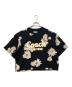 COACH（コーチ）の古着「フローラル クロップド シグネチャー スクリプト Tシャツ」｜ブラック