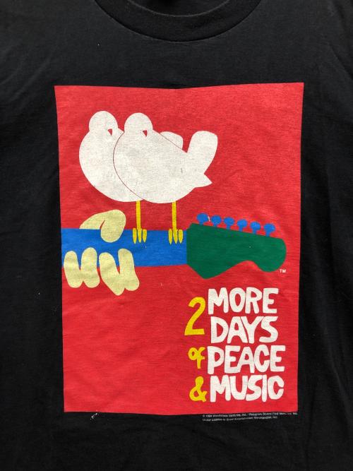 GEM Great Enterainment Merchandise（グレートエンターテイメントマーチャンダイズ）GEM Great Enterainment Merchandise (グレートエンターテイメントマーチャンダイズ) Woodstock Tシャツ ブラック サイズ:XLの古着・服飾アイテム