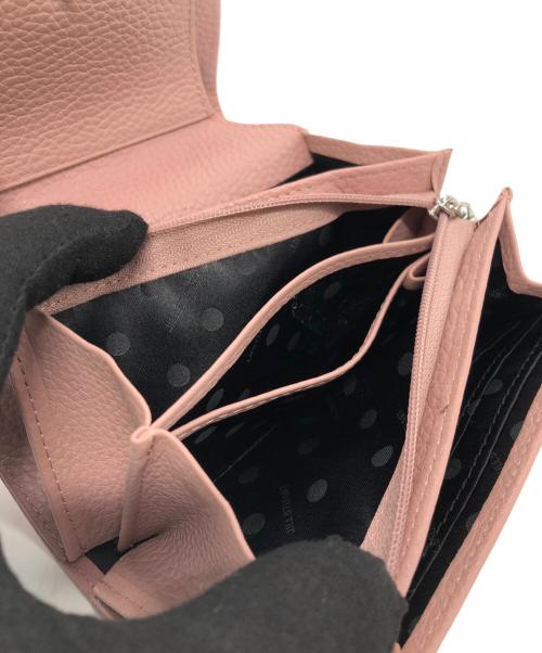 JILL STUART（ジルスチュアート）JILL STUART (ジルスチュアート) クルミボタン2つ折り財布 ピンクの古着・服飾アイテム