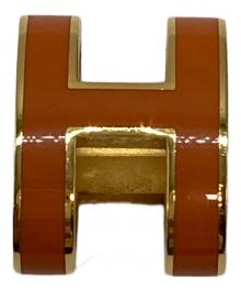 HERMES（エルメス）の古着「ペンダントトップ」｜オレンジ×ゴールド