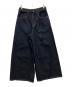 sacai（サカイ）の古着「BELTED BAGGY FLAIR DENIM PANTS」｜ネイビー