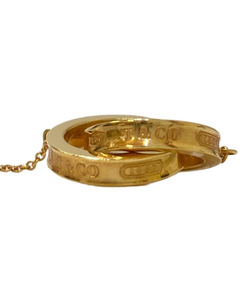TIFFANY & Co.（ティファニー）TIFFANY & Co. (ティファニー) 1837 インターロッキング ネックレス イエロー×ゴールドの古着・服飾アイテム