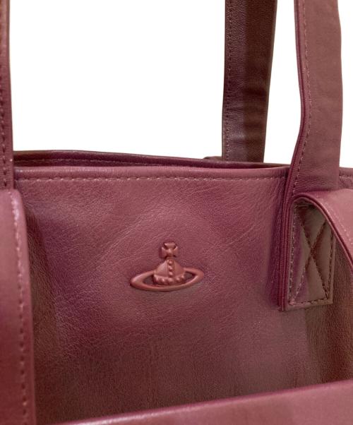 Vivienne Westwood（ヴィヴィアンウエストウッド）Vivienne Westwood (ヴィヴィアンウエストウッド) 裏地オーブ総柄 レザートートバッグ パープルの古着・服飾アイテム