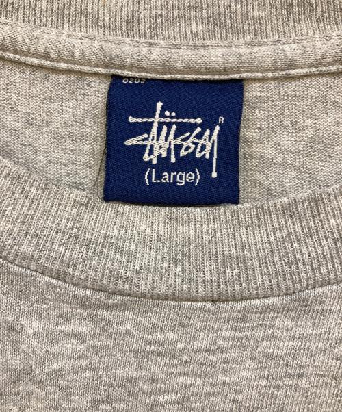 stussy（ステューシー）stussy (ステューシー) グラフィックロゴ クラウンプリントTシャツ グレー サイズ:Lの古着・服飾アイテム