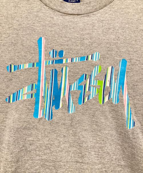 stussy（ステューシー）stussy (ステューシー) グラフィックロゴ クラウンプリントTシャツ グレー サイズ:Lの古着・服飾アイテム