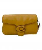 COACHコーチ）の古着「ピロータビーショルダーバッグ」｜イエロー