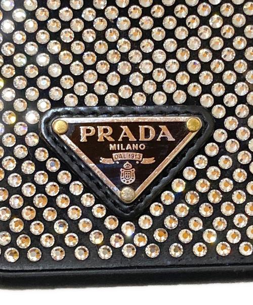 PRADA（プラダ）PRADA (プラダ) ラインストーン 三角ロゴプレート スマホケースの古着・服飾アイテム