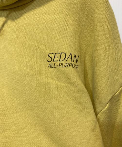 SEDAN ALL-PURPOSE（セダンオールパーパス）SEDAN ALL-PURPOSE (セダンオールパーパス) OG LOGO ELASTIC CORD HOODIE イエロー サイズ:XLの古着・服飾アイテム
