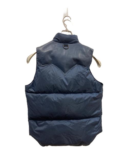 RockyMountainFeatherBed（ロッキーマウンテンフェザーベッド）RockyMountainFeatherBed (ロッキーマウンテンフェザーベッド) BRIEFING (ブリーフィング) BEAMS (ビームス) 別注ダウンベスト ブルー サイズ:36の古着・服飾アイテム
