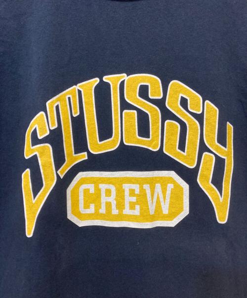 stussy（ステューシー）stussy (ステューシー) Champion (チャンピオン) プリントTシャツ ネイビー サイズ:XLの古着・服飾アイテム