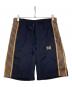 Needles（ニードルズ）の古着「サイドラインショートパンツ」｜ネイビー