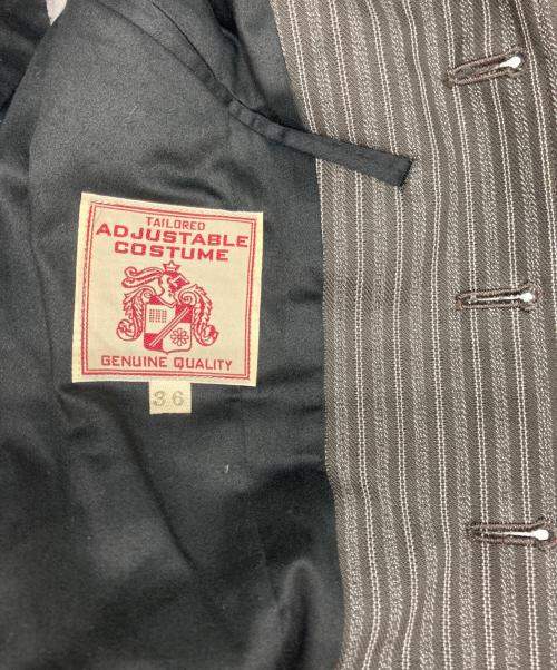 ADJUSTABLE COSTUME（アジャスタブルコスチューム）ADJUSTABLE COSTUME (アジャスタブルコスチューム) テーラードジャケット グレー サイズ:３６の古着・服飾アイテム
