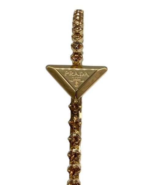 PRADA（プラダ）PRADA (プラダ) トライアングルロゴ ヘッドバンド カチューシャ ゴールドの古着・服飾アイテム