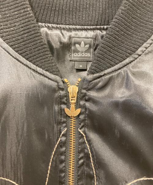 adidas（アディダス）adidas (アディダス) スカルボーンスカジャン ブラック×ゴールド サイズ:Ｍの古着・服飾アイテム