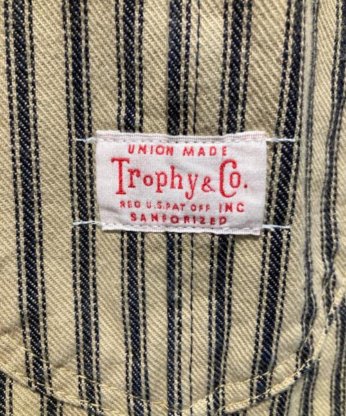Trophy Clothing（トロフィークロージング）Trophy Clothing (トロフィークロージング) ヒッコリーカバーオール ブラウン サイズ:不明の古着・服飾アイテム