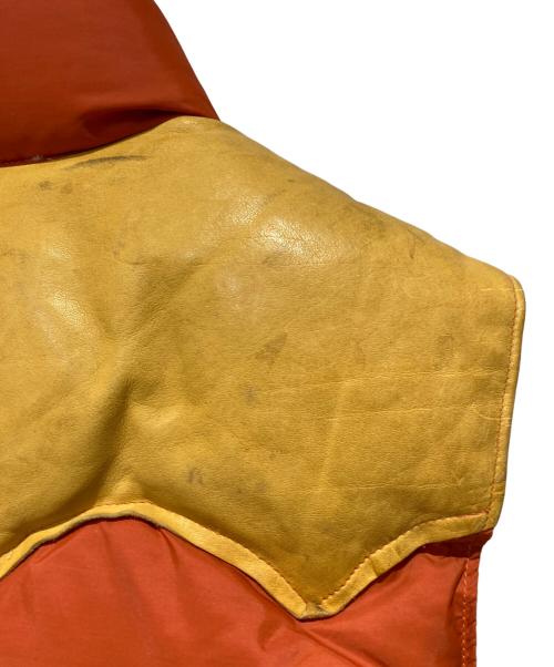 RockyMountainFeatherBed（ロッキーマウンテンフェザーベッド）RockyMountainFeatherBed (ロッキーマウンテンフェザーベッド) ダウンベスト オレンジ サイズ:不明の古着・服飾アイテム