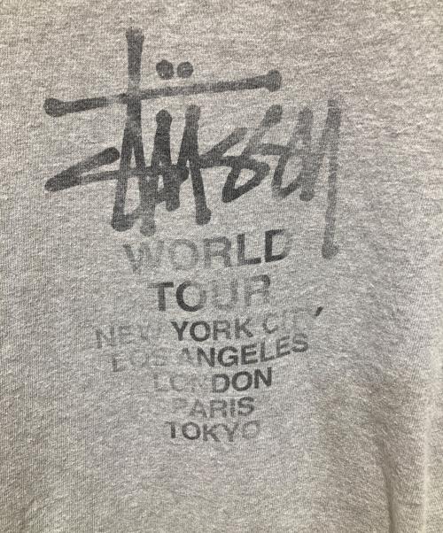 stussy（ステューシー）stussy (ステューシー) ワールドツアープリントTシャツ グレー サイズ:Lの古着・服飾アイテム