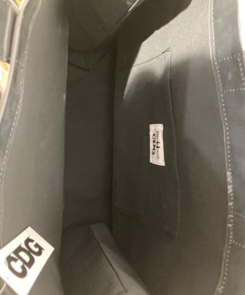 CDG（シーディージー）CDG (シーディージー) Übermensch (ウーバーメンシュ) ビニールハンドバッグ/ PAPER BAG ブラック 未使用品の古着・服飾アイテム
