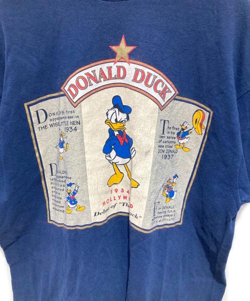 THE Disney Store（ザ ディズニー ストア）THE Disney Store (ザ ディズニー ストア) プリントTシャツ ネイビー サイズ:Ｌの古着・服飾アイテム