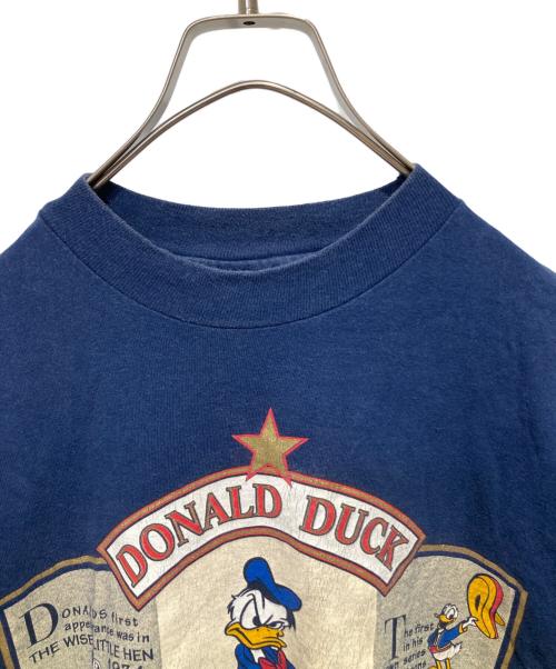 THE Disney Store（ザ ディズニー ストア）THE Disney Store (ザ ディズニー ストア) プリントTシャツ ネイビー サイズ:Ｌの古着・服飾アイテム