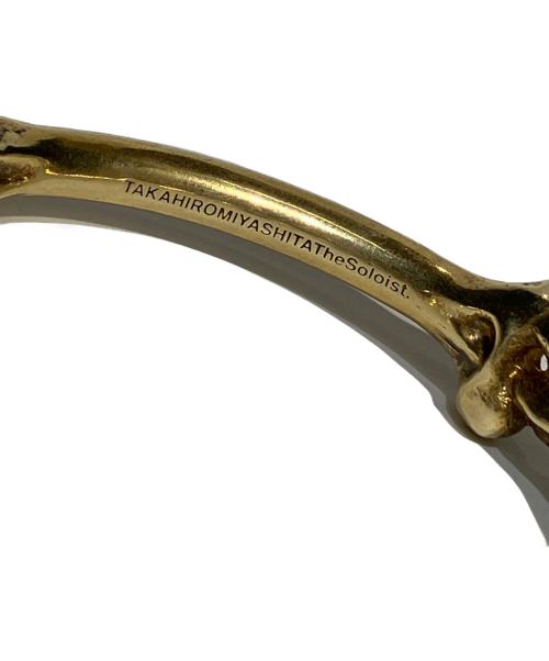 TAKAHIROMIYASHITA TheSoloIst.（タカヒロミヤシタ ザソロイスト）TAKAHIROMIYASHITA TheSoloIst. (タカヒロミヤシタ ザソロイスト) END (エンド) bone shaped clip cuff ゴールド サイズ:Mの古着・服飾アイテム