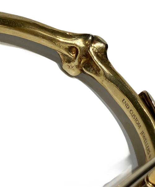 TAKAHIROMIYASHITA TheSoloIst.（タカヒロミヤシタ ザソロイスト）TAKAHIROMIYASHITA TheSoloIst. (タカヒロミヤシタ ザソロイスト) END (エンド) bone shaped clip cuff ゴールド サイズ:Mの古着・服飾アイテム