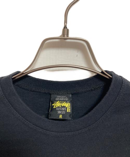 stussy（ステューシー）stussy (ステューシー) POUND (パウンド) プリントTシャツ ブラック サイズ:Mの古着・服飾アイテム