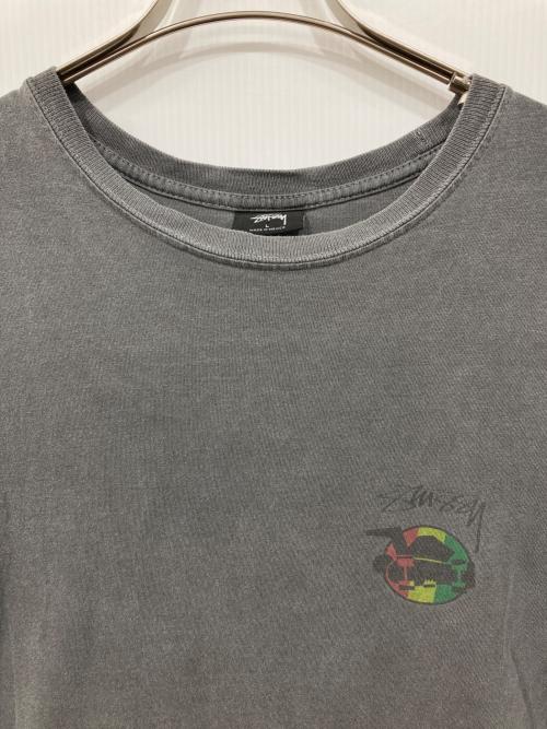 stussy（ステューシー）stussy (ステューシー) スケボーマンラスタサークルTシャツ ブラック サイズ:Lの古着・服飾アイテム
