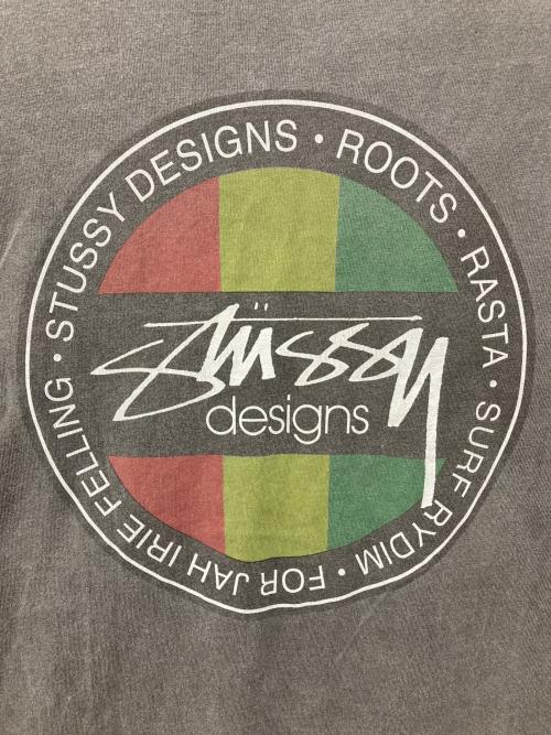 stussy（ステューシー）stussy (ステューシー) スケボーマンラスタサークルTシャツ ブラック サイズ:Lの古着・服飾アイテム
