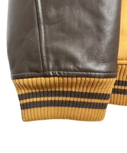 Timberland（ティンバーランド）Timberland (ティンバーランド) ロゴ刺繍レザースリーブスタジャン ベージュ サイズ:XLの古着・服飾アイテム