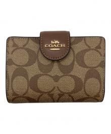 COACH（コーチ）の古着「ミディアム コーナー ジップ ウォレット シグネチャー キャンバス」｜ベージュ