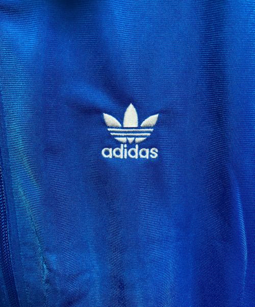 adidas（アディダス）adidas (アディダス) アディカラー クラシックス ルーズ ファイヤーバード トラックトップ ブルー サイズ:L 未使用品の古着・服飾アイテム