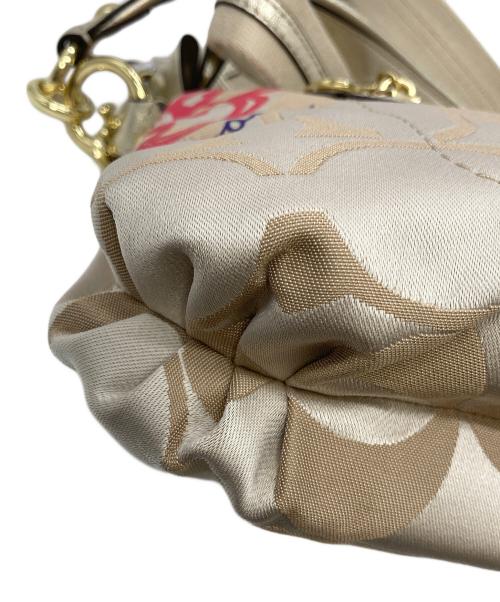 COACH（コーチ）COACH (コーチ) ポピー デイジー シグネチャー2WAYバッグ ベージュの古着・服飾アイテム