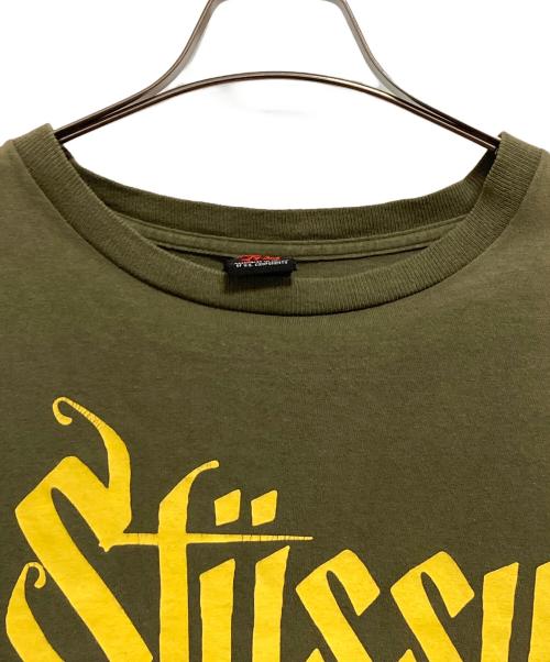 stussy（ステューシー）stussy (ステューシー) Old Skull Tribe tシャツ グリーン×イエロー サイズ:XLの古着・服飾アイテム