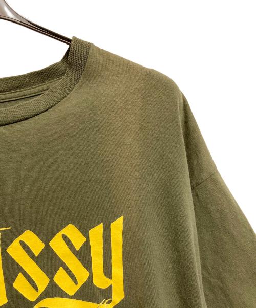 stussy（ステューシー）stussy (ステューシー) Old Skull Tribe tシャツ グリーン×イエロー サイズ:XLの古着・服飾アイテム