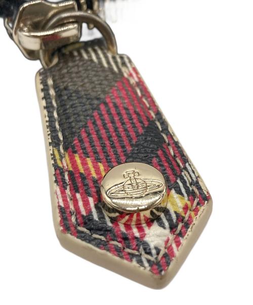 Vivienne Westwood（ヴィヴィアンウエストウッド）Vivienne Westwood (ヴィヴィアンウエストウッド) ラウンドファスナー長財布 ベージュ×レッドの古着・服飾アイテム