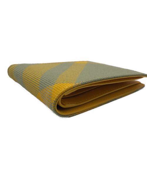 BURBERRY（バーバリー）BURBERRY (バーバリー) 2つ折り財布 イエローの古着・服飾アイテム