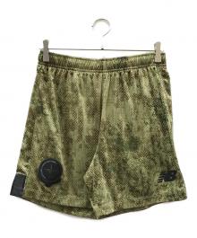 STONE ISLAND×NEW BALANCE（ストーンアイランド×ニューバランス）の古着「フットボールショーツ」｜オリーブ