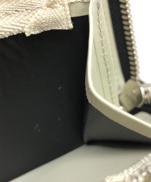 UNDERCOVERISM（アンダーカバーイズム）UNDERCOVERISM (アンダーカバーイズム) 総柄レザーL字ZIPポーチ財布 ブラック サイズ:下記参照の古着・服飾アイテム